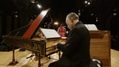Alexander Weimann playing the harpsichord on stage